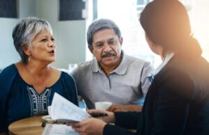 Elderly man, elderly woman and attorney with paperwork, negotiation and legal agreement